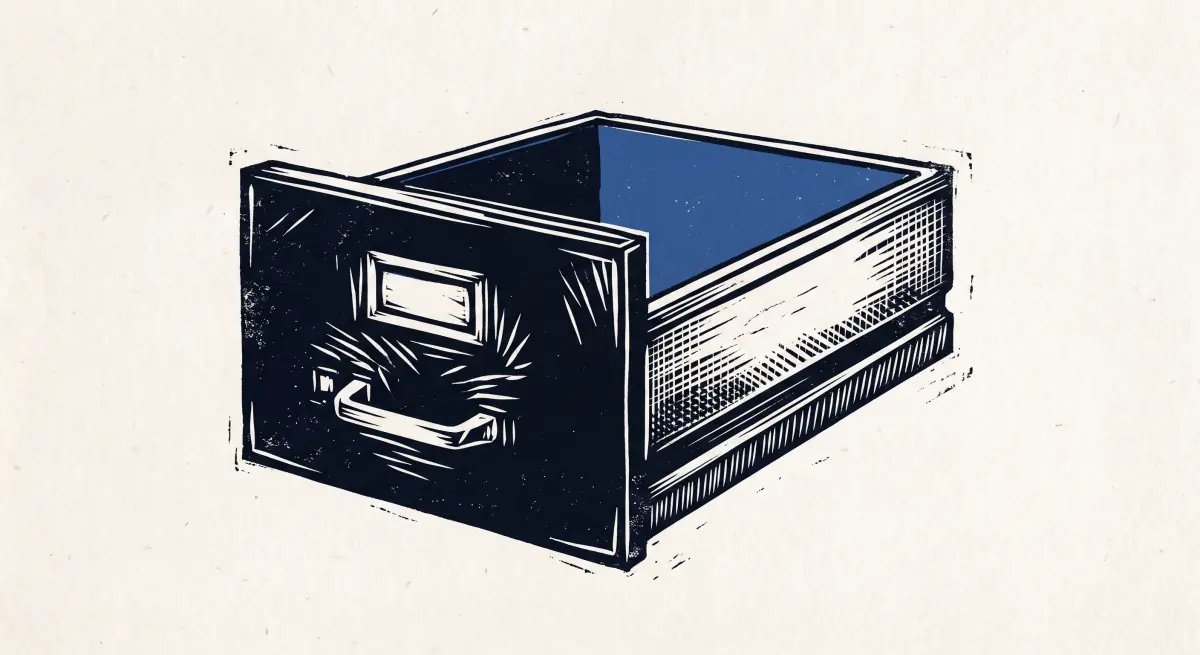 Linocut illustration of an open office file drawer, completely empty, its blank label holder waiting to be filled in.